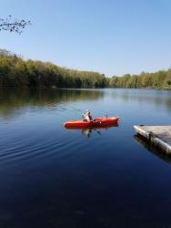camper using their own kayak -- you can bring your own boats and pay a launch fee